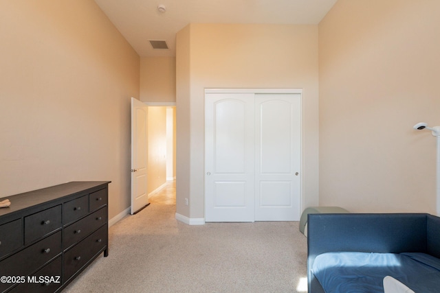 13715 N Tessali Way, Tucson, AZ 85755 - bedroom with light colored carpet, a closet, and baseboards