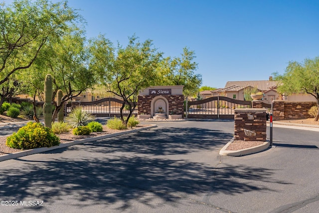 13715 N Tessali Way, Tucson, AZ 85755 - view of asphalt street featuring curbs, a gate, and a gated entry