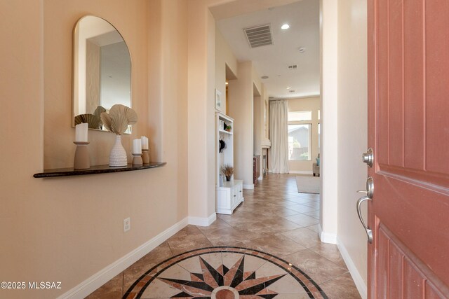 13715 N Tessali Way, Tucson, AZ 85755 - entrance foyer with baseboards, recessed lighting, inlaid floor details, and light tile patterned floors
