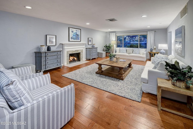 4255 E Calle De Madrid, Tucson, AZ 85711 - living room with hardwood / wood-style flooring, a fireplace with flush hearth, and recessed lighting