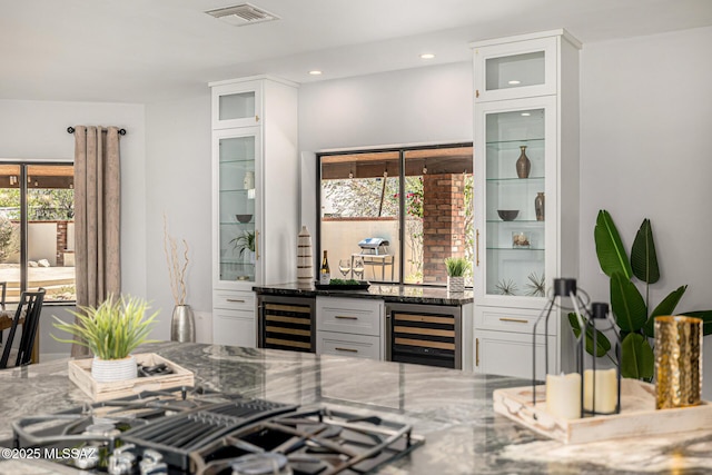 9840 N Desert Sky Rd, Tucson, AZ 85737 - indoor bar featuring beverage cooler, black gas stovetop, and recessed lighting