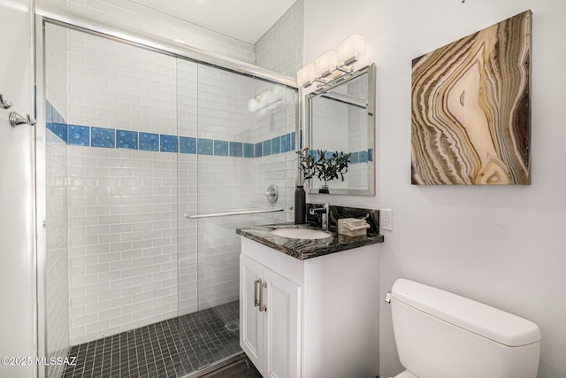 9840 N Desert Sky Rd, Tucson, AZ 85737 - bathroom featuring toilet, vanity, and a stall shower