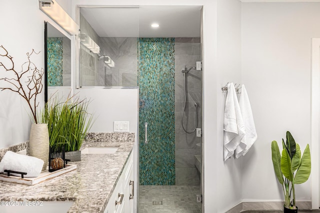 9840 N Desert Sky Rd, Tucson, AZ 85737 - full bath with a stall shower, double vanity, and recessed lighting