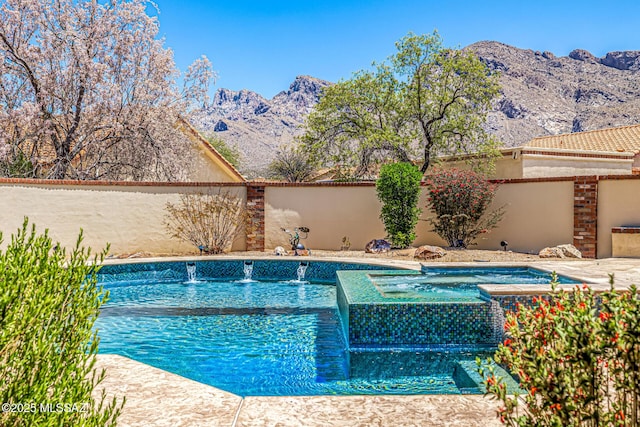 9840 N Desert Sky Rd, Tucson, AZ 85737 - swimming pool with an in-ground hot tub and a mountain view