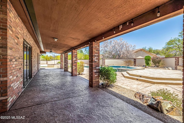 9840 N Desert Sky Rd, Tucson, AZ 85737 - fenced backyard with a patio area