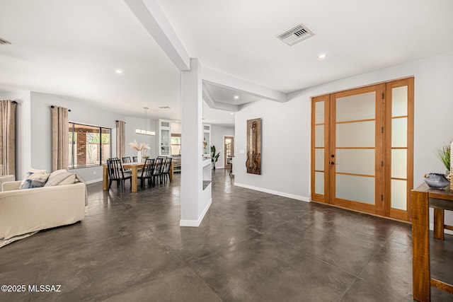 9840 N Desert Sky Rd, Tucson, AZ 85737 - living area with finished concrete floors, recessed lighting, and baseboards