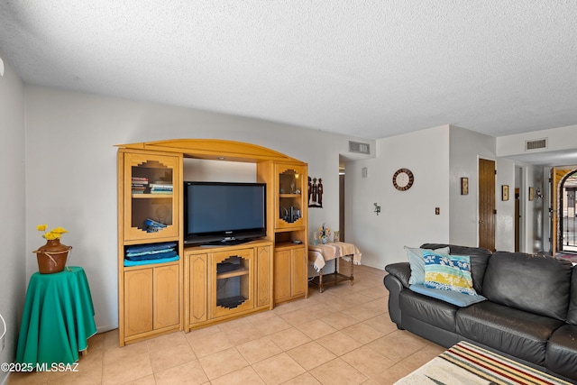 2819 W Jennie Ln, Tucson, AZ 85713 - living room with a textured ceiling and light tile patterned floors