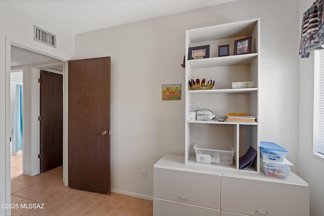 2819 W Jennie Ln, Tucson, AZ 85713 - bedroom featuring light tile patterned floors and baseboards