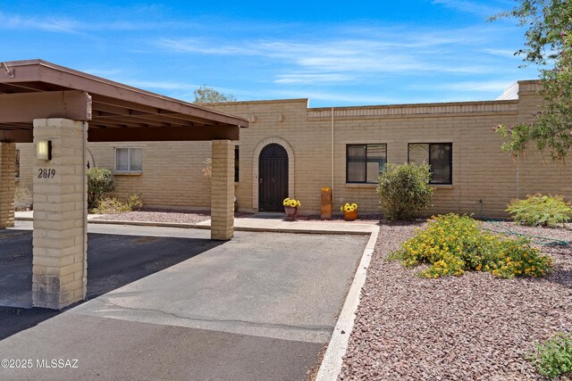 2819 W Jennie Ln, Tucson, AZ 85713 - view of front of house with brick siding and covered parking
