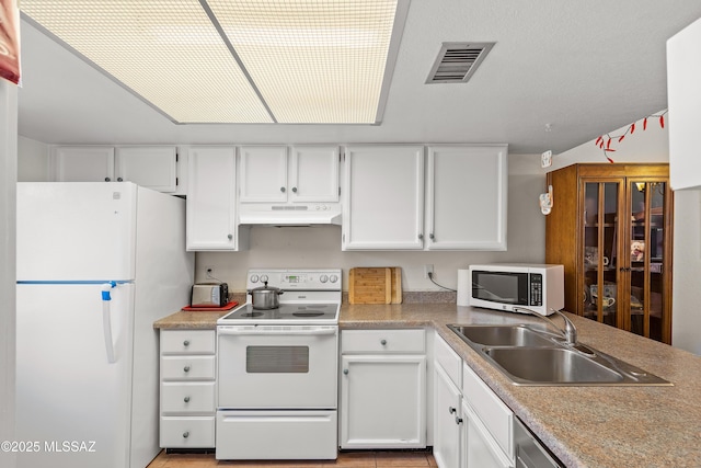 2819 W Jennie Ln, Tucson, AZ 85713 - kitchen featuring white appliances, under cabinet range hood, a sink, white cabinetry, and light countertops