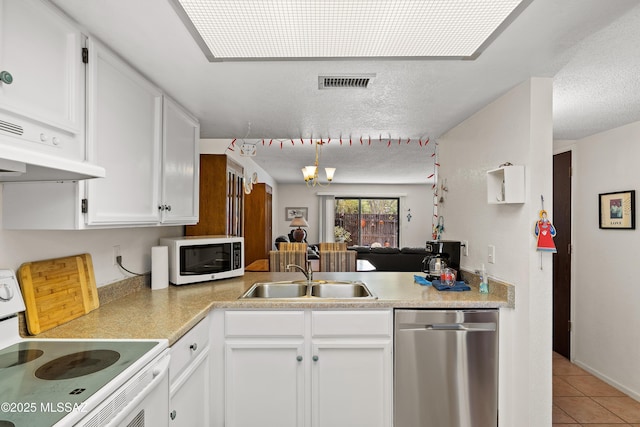 2819 W Jennie Ln, Tucson, AZ 85713 - kitchen featuring white appliances, a sink, light tile patterned floors, white cabinets, and a textured ceiling