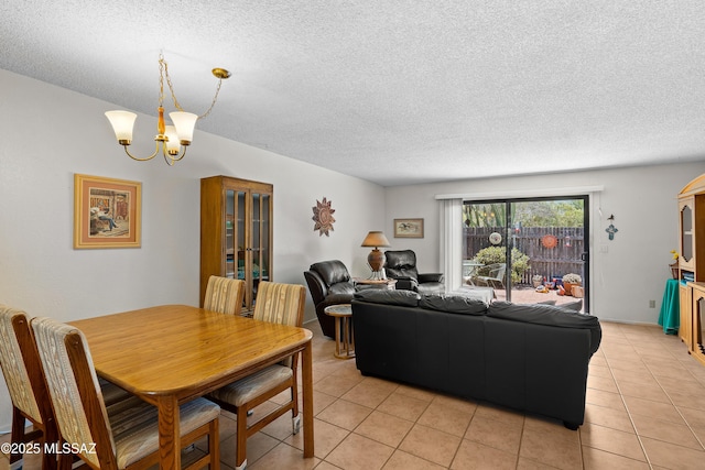 2819 W Jennie Ln, Tucson, AZ 85713 - living room featuring light tile patterned floors, a chandelier, and a textured ceiling