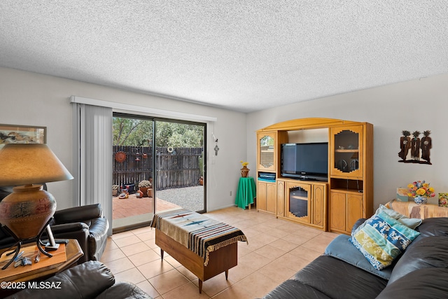 2819 W Jennie Ln, Tucson, AZ 85713 - living room with light tile patterned flooring and a textured ceiling