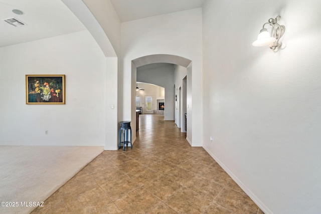 1048 E Rodda River Pl, Tucson, AZ 85718 - hallway with arched walkways and a high ceiling