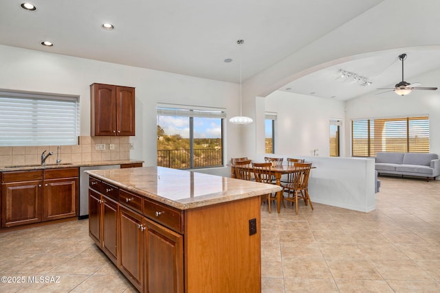 1048 E Rodda River Pl, Tucson, AZ 85718 - kitchen featuring dishwasher, light tile patterned floors, ceiling fan, arched walkways, and recessed lighting