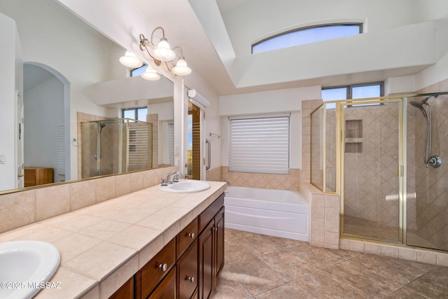 1048 E Rodda River Pl, Tucson, AZ 85718 - bathroom with a garden tub, double vanity, a stall shower, and a towering ceiling