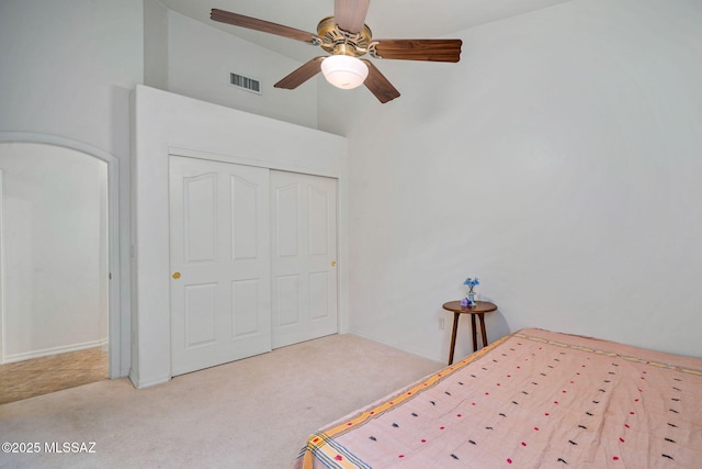 1048 E Rodda River Pl, Tucson, AZ 85718 - unfurnished bedroom featuring carpet flooring, a closet, high vaulted ceiling, and a ceiling fan