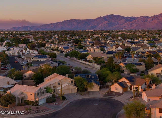 8944 N Hartman Ln, Tucson, AZ 85742 - aerial view at dusk of a mountain view and a residential view