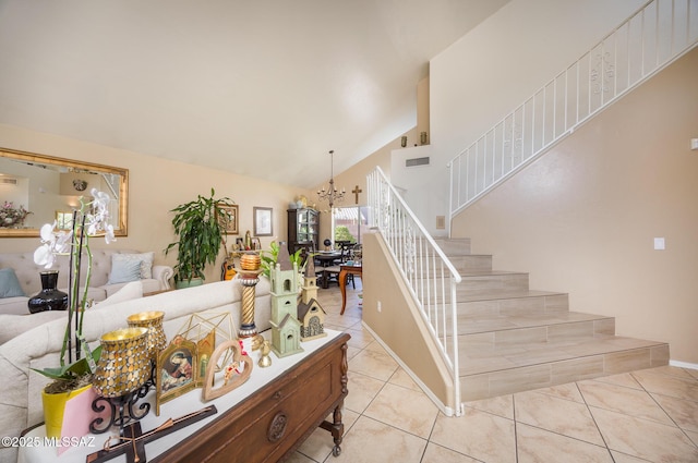 8944 N Hartman Ln, Tucson, AZ 85742 - stairway featuring a chandelier, tile patterned floors, high vaulted ceiling, and baseboards