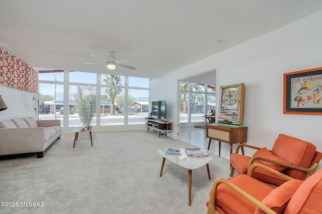 8312 E Koralee Pl, Tucson, AZ 85710 - carpeted living room featuring ceiling fan and a wall of windows