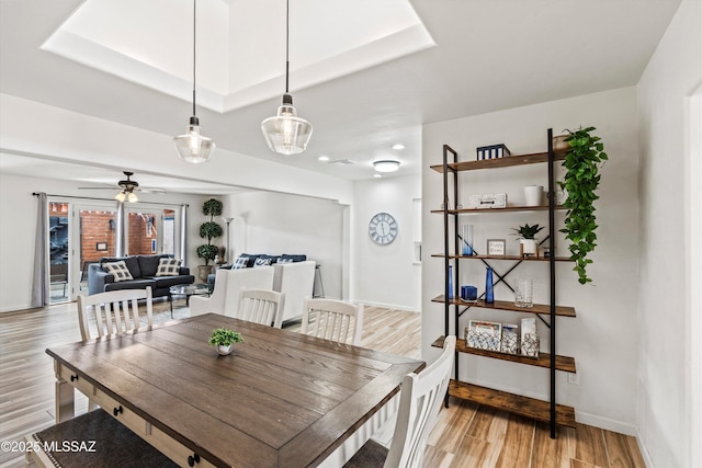5247 E 6th St, Tucson, AZ 85711 - dining space featuring light wood-type flooring, baseboards, and ceiling fan
