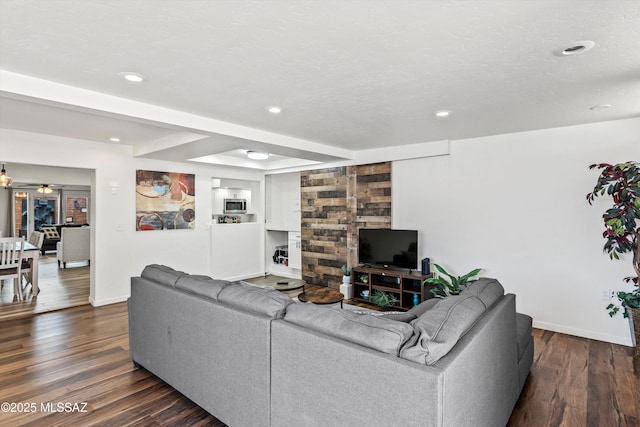 5247 E 6th St, Tucson, AZ 85711 - living room with dark wood-style floors, baseboards, and recessed lighting