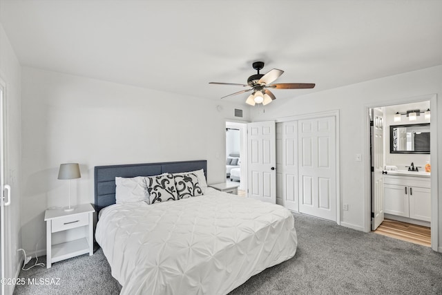 5247 E 6th St, Tucson, AZ 85711 - carpeted bedroom with a closet, a sink, a ceiling fan, ensuite bathroom, and baseboards
