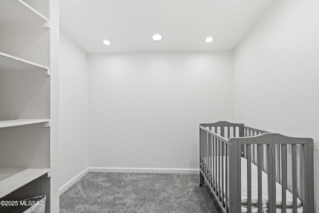 5247 E 6th St, Tucson, AZ 85711 - unfurnished bedroom with carpet flooring, recessed lighting, baseboards, and a nursery area