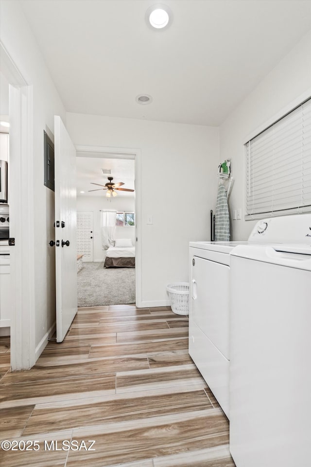 5247 E 6th St, Tucson, AZ 85711 - laundry area with washing machine and clothes dryer, light wood finished floors, a ceiling fan, recessed lighting, and baseboards