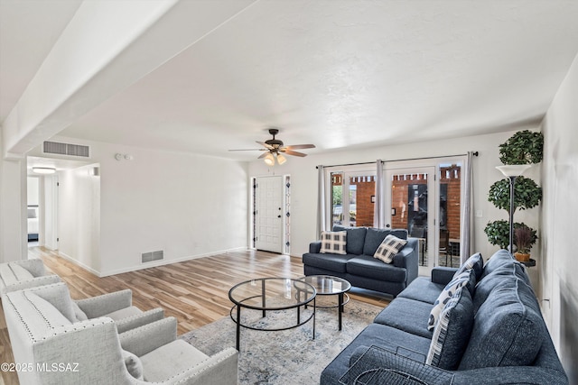 5247 E 6th St, Tucson, AZ 85711 - living area featuring light wood-style flooring, ceiling fan, and baseboards