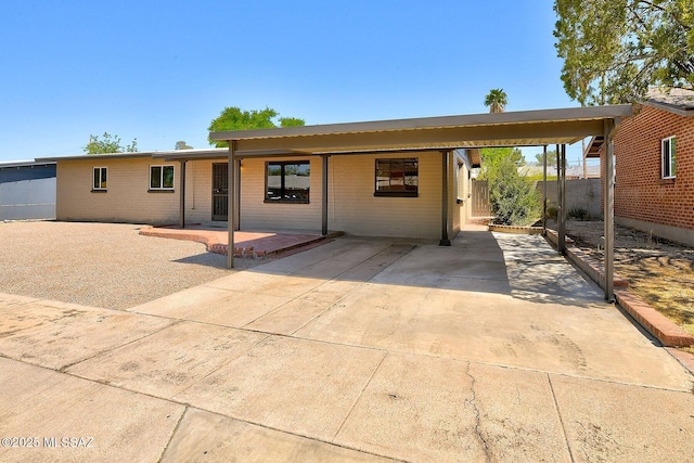 5721 E Scarlett St, Tucson, AZ 85711 - view of front of property featuring concrete driveway