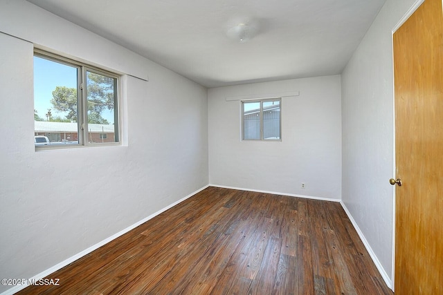 5721 E Scarlett St, Tucson, AZ 85711 - unfurnished room featuring hardwood / wood-style floors and baseboards