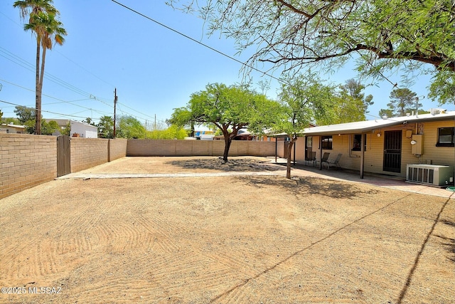 5721 E Scarlett St, Tucson, AZ 85711 - fenced backyard featuring central AC and a patio