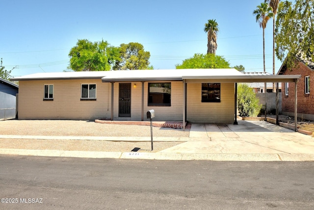 5721 E Scarlett St, Tucson, AZ 85711 - ranch-style house with an attached carport