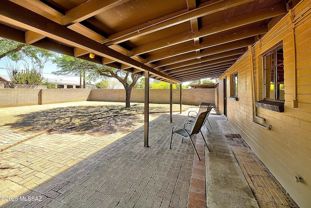 5721 E Scarlett St, Tucson, AZ 85711 - fenced backyard with a patio area