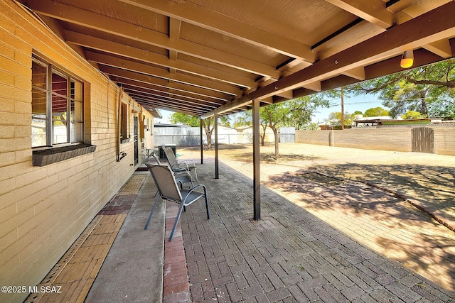 5721 E Scarlett St, Tucson, AZ 85711 - fenced backyard with a patio area