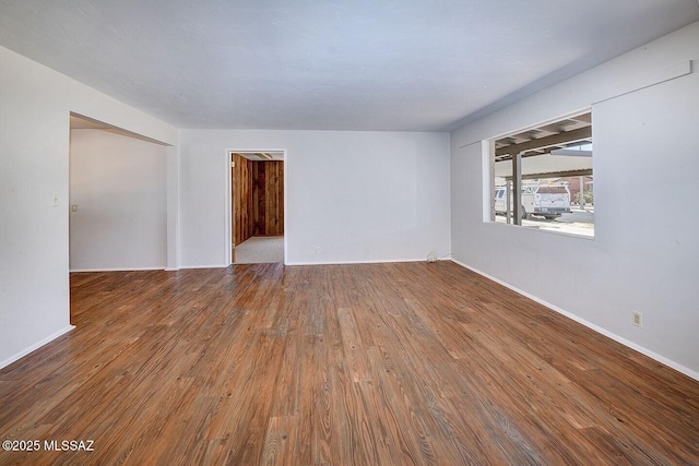 5721 E Scarlett St, Tucson, AZ 85711 - spare room with wood finished floors and baseboards