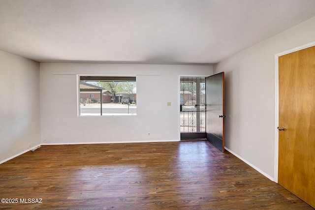 5721 E Scarlett St, Tucson, AZ 85711 - spare room with wood finished floors and baseboards