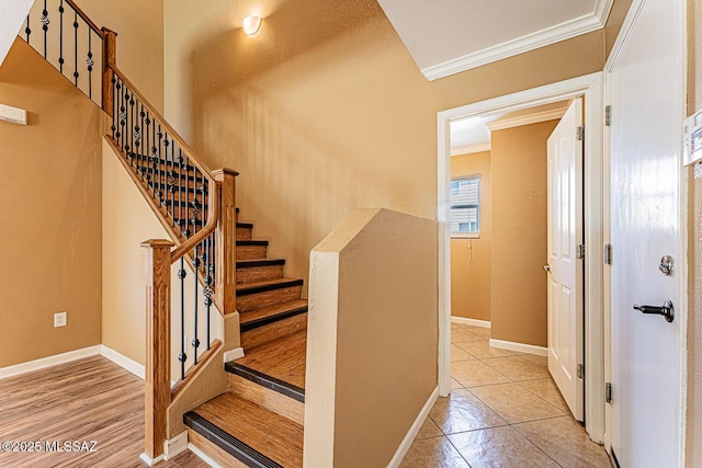 1173 W Calle Vista De Suenos, Sahuarita, AZ 85629 - staircase with crown molding, baseboards, and tile patterned floors