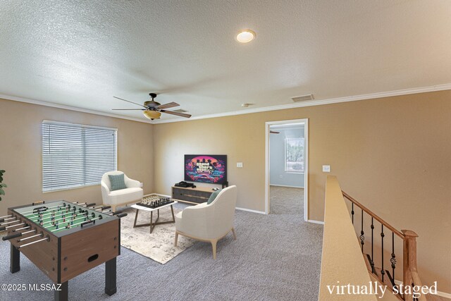 1173 W Calle Vista De Suenos, Sahuarita, AZ 85629 - recreation room featuring ornamental molding, carpet, ceiling fan, plenty of natural light, and baseboards