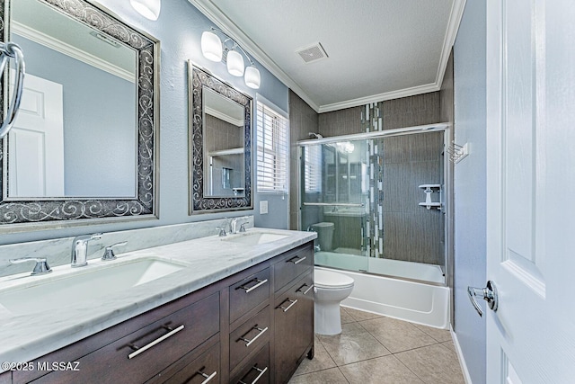 1173 W Calle Vista De Suenos, Sahuarita, AZ 85629 - full bathroom featuring toilet, ornamental molding, double vanity, tile patterned floors, and combined bath / shower with glass door