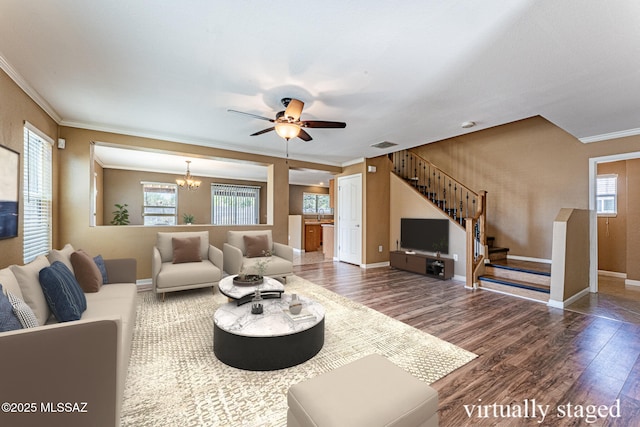 1173 W Calle Vista De Suenos, Sahuarita, AZ 85629 - living room featuring wood finished floors, ornamental molding, stairway, baseboards, and a ceiling fan