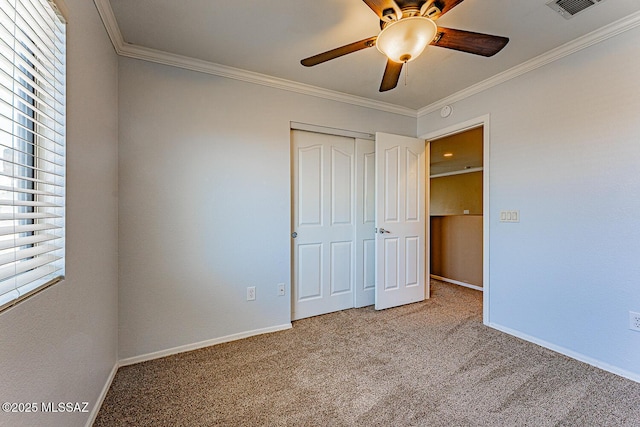 1173 W Calle Vista De Suenos, Sahuarita, AZ 85629 - unfurnished bedroom with carpet, ornamental molding, a closet, baseboards, and ceiling fan
