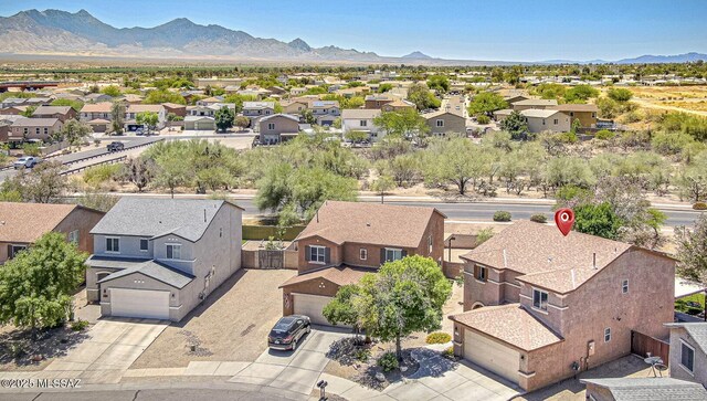 1173 W Calle Vista De Suenos, Sahuarita, AZ 85629 - aerial view of residential area featuring a mountain backdrop