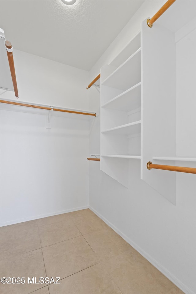 12122 N Sterling Ave, Oro Valley, AZ 85755 - spacious closet with tile patterned flooring
