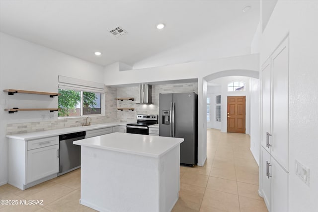 12122 N Sterling Ave, Oro Valley, AZ 85755 - kitchen with appliances with stainless steel finishes, open shelves, extractor fan, tasteful backsplash, and lofted ceiling