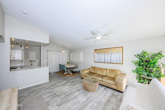 2943 N Gold Creek Pl, Tucson, AZ 85745 - living room with vaulted ceiling, wood finished floors, and a ceiling fan