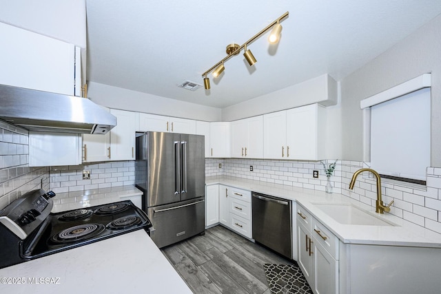 2943 N Gold Creek Pl, Tucson, AZ 85745 - kitchen with stainless steel appliances, a sink, light countertops, and white cabinets