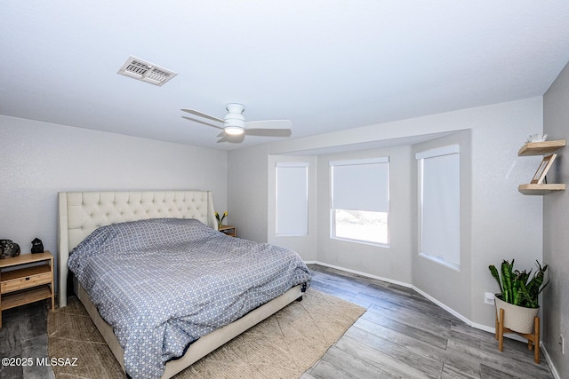 2943 N Gold Creek Pl, Tucson, AZ 85745 - bedroom with baseboards, wood finished floors, and a ceiling fan