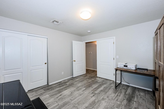 2943 N Gold Creek Pl, Tucson, AZ 85745 - home office with wood finished floors and baseboards